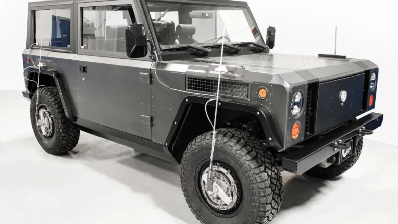 Bollinger B1 electric SUV with wheel force transducers on its wheels and cables running up to the body