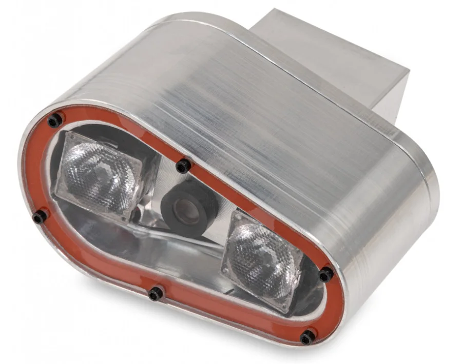 TrueSlip sensor seen from the road side, with two infrared lamps and the optical lens between them