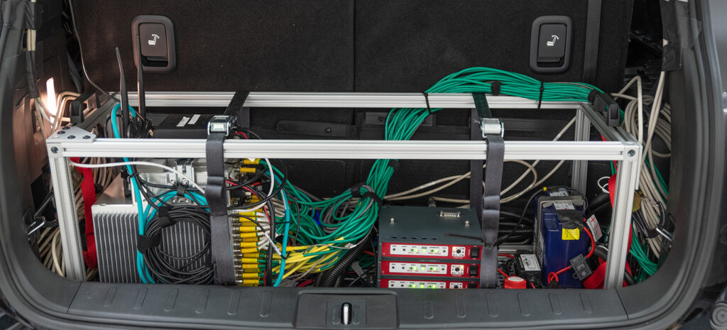Data acquisition system and its wiring installed in the trunk of a vehicle