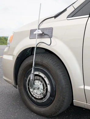 Wheel torque transducer installed on a vehicle wheel with its adapters